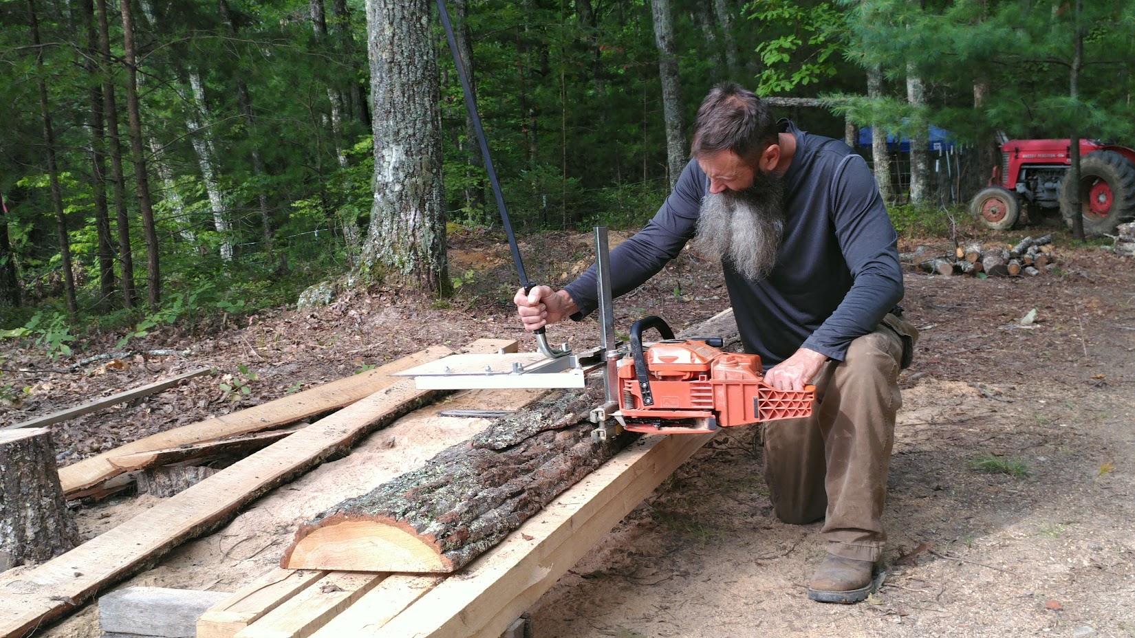Man operating an Alaskan chainsaw mill 